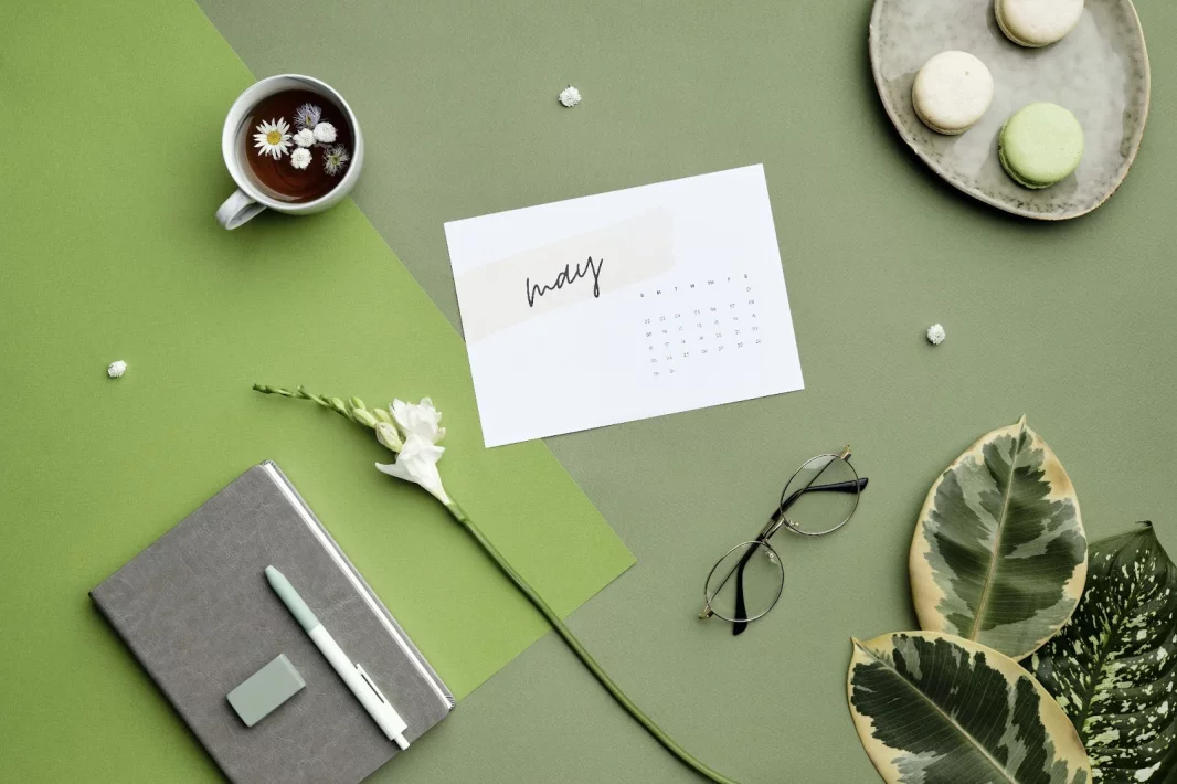 Photo of a desktop with a notebook, pen and eraser