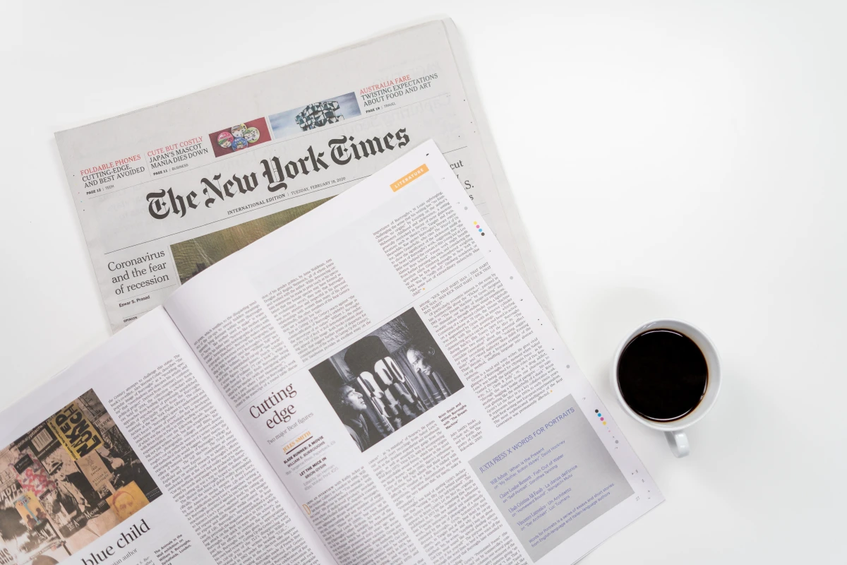 Photo of a newspaper and coffee cup